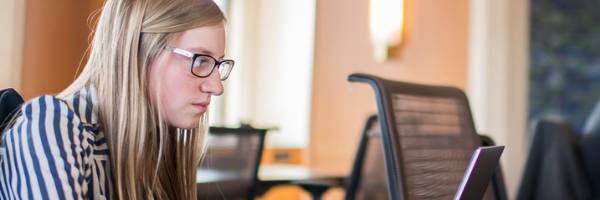 woman looking at laptop